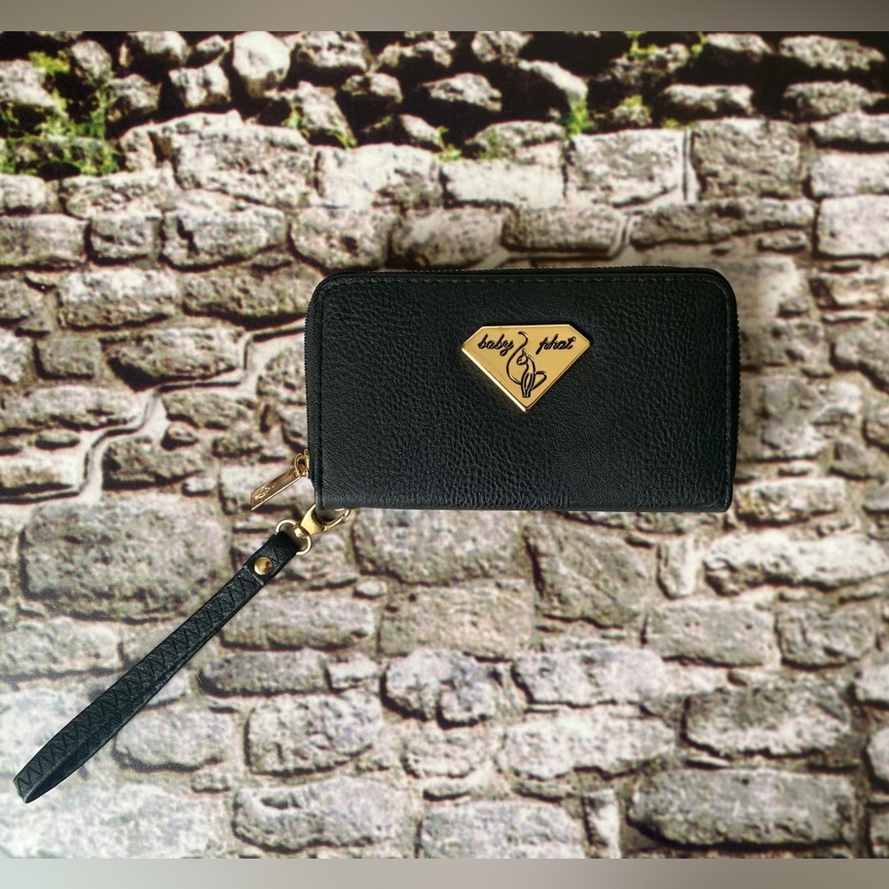 Baby Phat wallet. Black and gold. With wristlet strap
